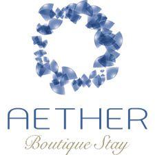 Aether Boutique Stay logo with blue abstract circular design and elegant text