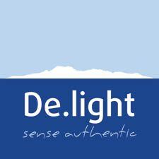 De.light company logo with mountain silhouette and 'sense authentic' tagline on blue background