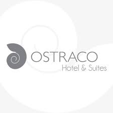 Ostraco Hotel & Suites logo with stylized grey spiral shell design