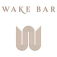 Wake Bar logo with stylized geometric design in tan and beige tones